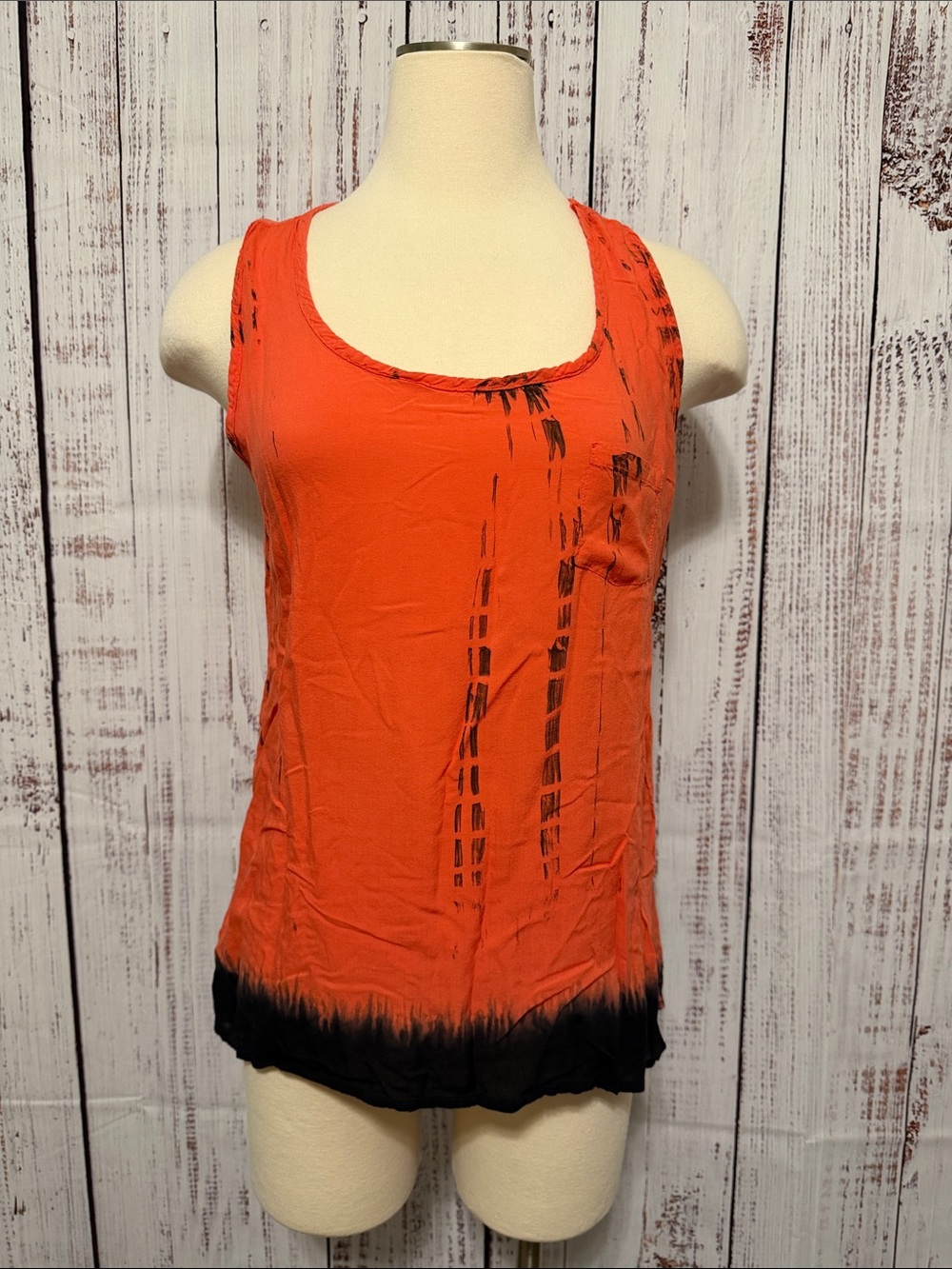 edge Orange Scoop Neck Tank with Black Hem and Abstract Accents